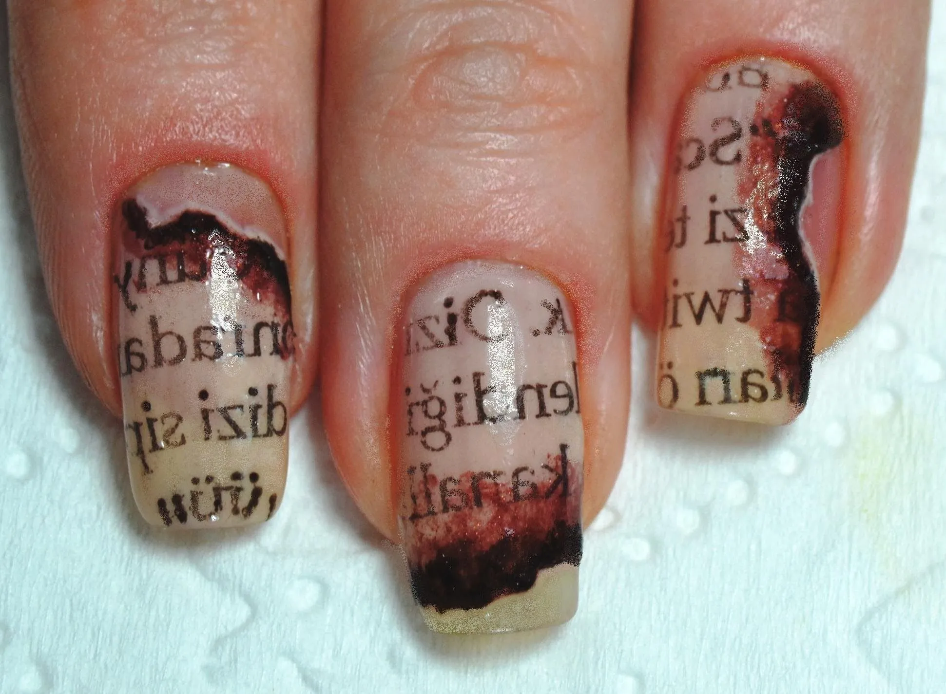 Source Pinterest Burnt Newspaper Nail Art
